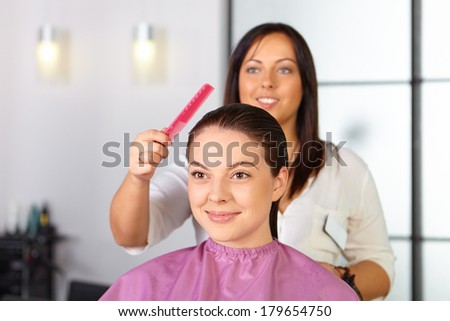 Hair salon. Woman haircut. Cutting.