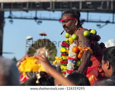 BATU CAVES, MALAYSIA - JANUARY 27:  A devotee is being carried by retainers during the long march of Thaipusam in Batu Caves, Malaysia on January 27, 2013.