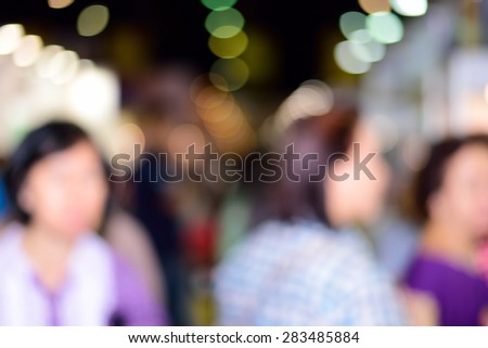 Blurred Crowd of People On Street, unrecognizable crowded population as blur urban background