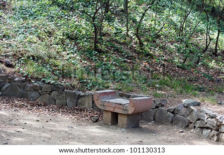Spring time: stone bench in the garden