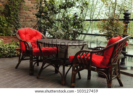 Red chairs outdoor with table
