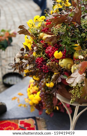 Autumn flowers and fruits in big composition