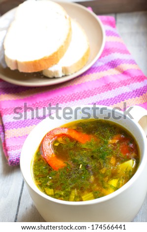 Dinner time, vegetable soup with pepper on the table
