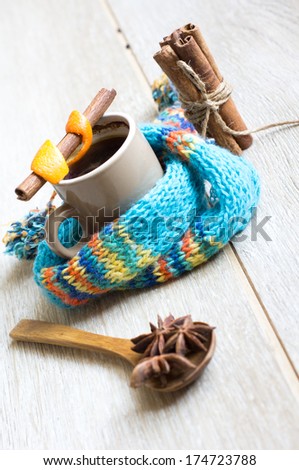 Cup of coffee with spices, cinnamon, anise and coffee beans