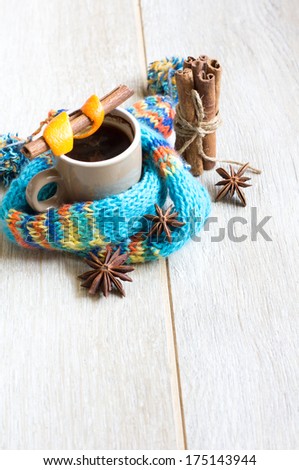Cup of coffee with spices, cinnamon, anise and coffee beans