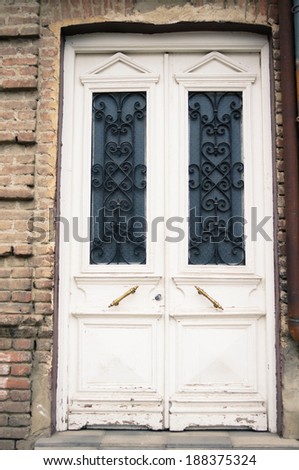 Art-Nouveau door with forged iron in Tbilisi Old town, unrestored area