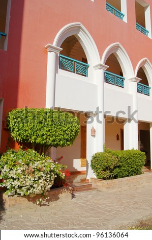 Courtyard of mediterranean villa with ceramic tile walkway  and steps in Egypt