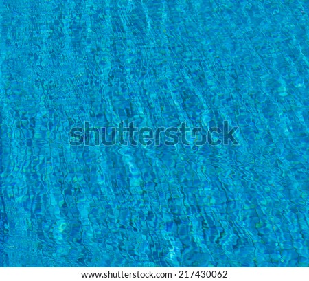 Outdoor pool in the tropical area with blue water