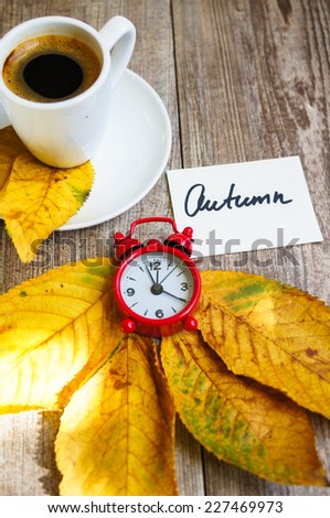 Autumn time, cup of coffee, yellow autumnal leaves and notes