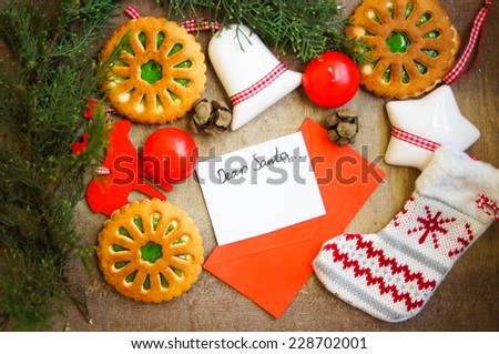 Christmas time decoration, cookies, cinnamon, anise star, lamp and letter to Santa