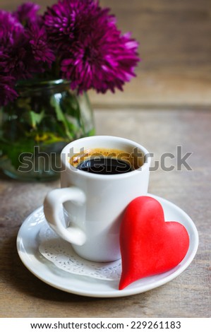 Cup of coffee, flowers, cookies and love note