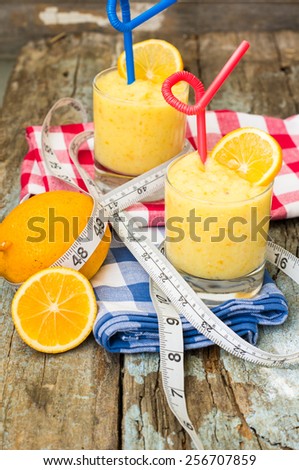 Healthy food, lemon smoothie with lemon fruits on the wooden background