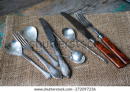 Vintage silverware on the old wooden table