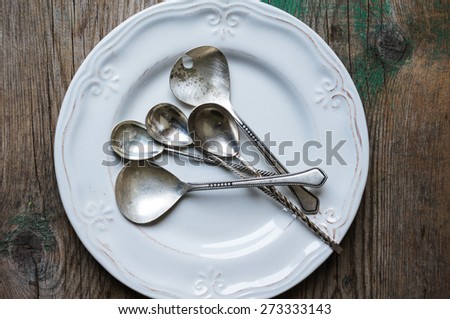 Vintage silverware on the old wooden table