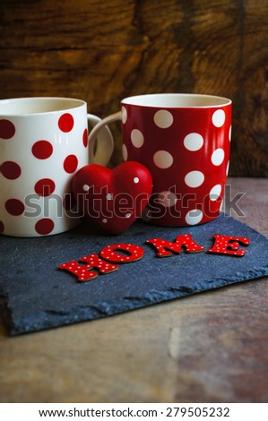 Red tea cup with tea and lemon on the old wooden background with note