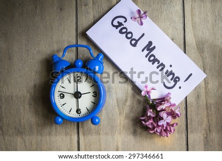 Lilac flowers and good morning note on the rustic style background