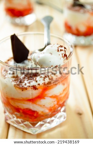 thick Greek yoghurt with cranberry dip and chocolate curls