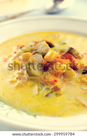 Vegetarian corn soup with brussels sprouts and other vegetables