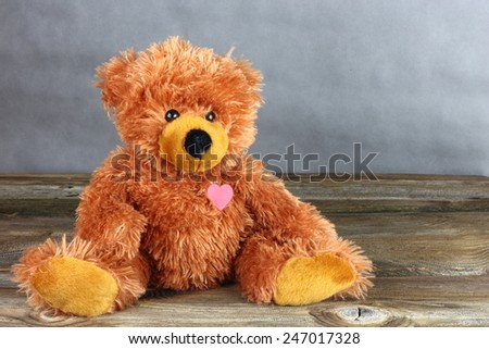 Teddy Bear with a heart / Teddy Bear - valentine\'s Day- grey background