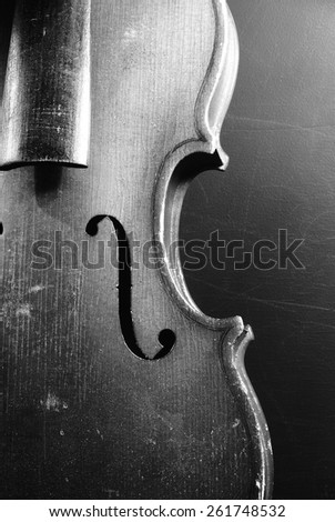 Vintage classical violin grunge black background / old broken fiddle