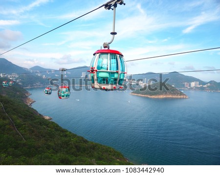 Attraction scenery high angle view of South China Sea, Island and surround hills from Hong Kong Ocean Park cable car which send people between the Waterfront and the Summit.