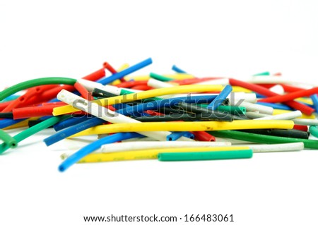 Network chaos of colorful cables on white background.