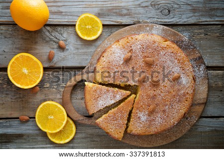 Orange cake on the wooden background