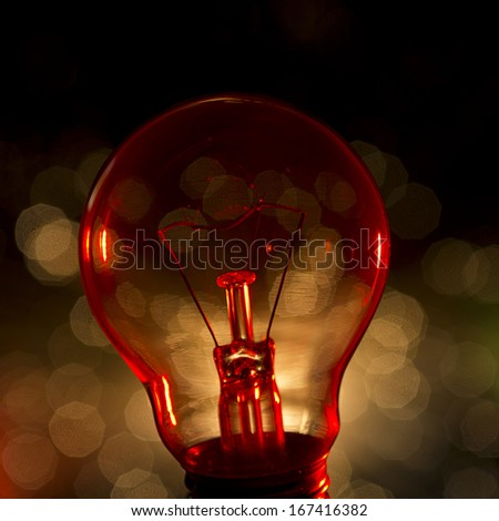 Lightbulb with unfocused light in background.