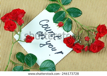 Note Count on you,  written on white paper and framed with roses.