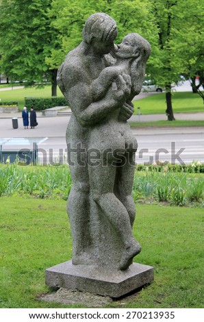 ESTONIA, TALLINN / JUNE 01 / 2014 - Kissing man and woman sculpture as park decoration in Tallinn.