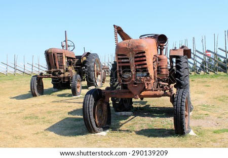 ESTONIA, SAAREMAA ISLAND / AUGUST 08 / 2014 - Two old tractors. Fragment of the Angla museum exposition.