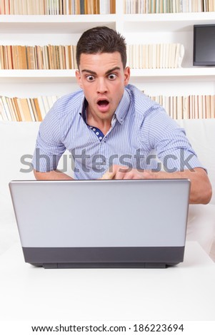 business man looks surprised at content on computer monitor failure, hacked stolen password