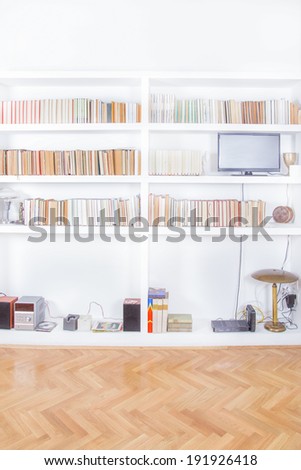 living room with tv and bookcase rendering, domestic atmosphere, library background indoors, clean and modern decoration