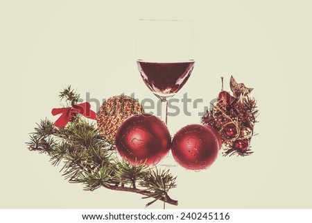 Christmas decoration with green pine and blue snow round ball ornaments for Christmas tree with glass wine. Holiday decorations isolated on white vintage retro background. Empty space for greeting card