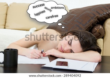Female student tired and sleeping in her bed room over the notes while was studying. Young woman learning in living room, she is tired. Education and business concept, girl with pile of notes indoors
