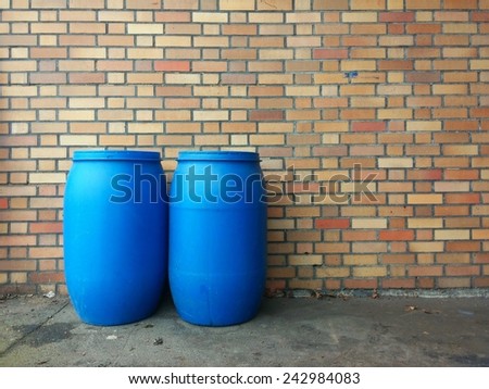 two blue chemicals barrels background