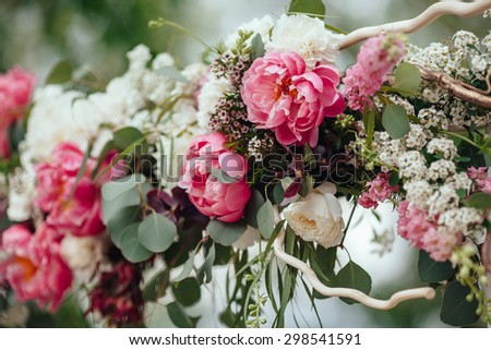 archway of many beautiful flowers, wedding arch with peonies