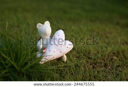 Handmade bear and heart on green grass , Valentine`s day Wallpaper.