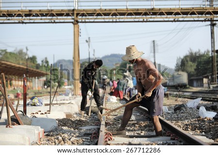 Suratthani,Thailand,April 8,2015 : Workers with tools repair rail lines on Suratthani train station.