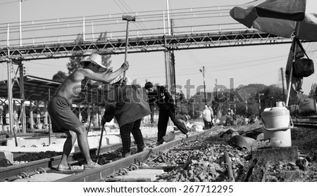 Suratthani,Thailand,April 8,2015 : Workers with tools repair rail lines on Suratthani train station.