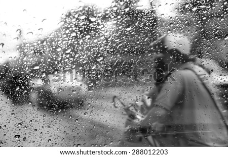 Heavy rush hour traffic in the rain,View through the window and Shallow depth of field composition.