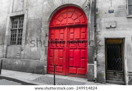 Paris, France-July 11, red door of a historic building, July 11.2014 in Paris