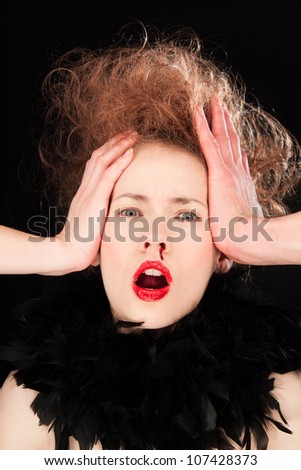 Beautiful young woman raising her hands to her head in horror as she bleeds from her nose