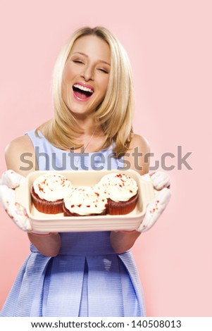 young blonde woman with cakes