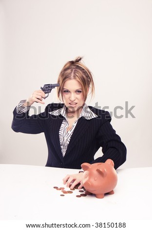 Attractive young businesswoman with gun shooting herself because of money problems