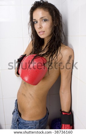 Beautiful topless glamour woman with red boxing gloves