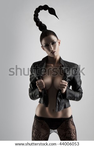 stock photo : crazy looking girl with a scorpion style hairstyle wearing 