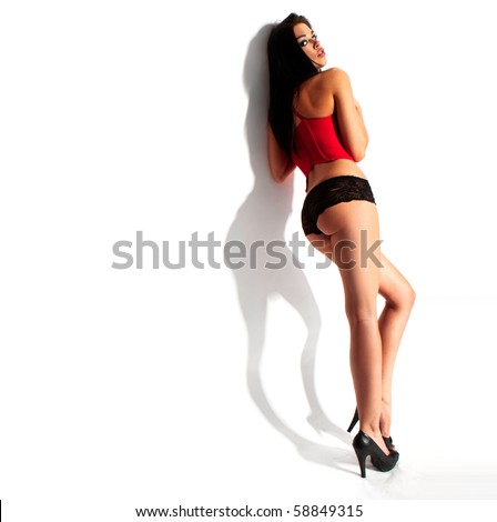 stock photo Perfect girl's body wearing red corset