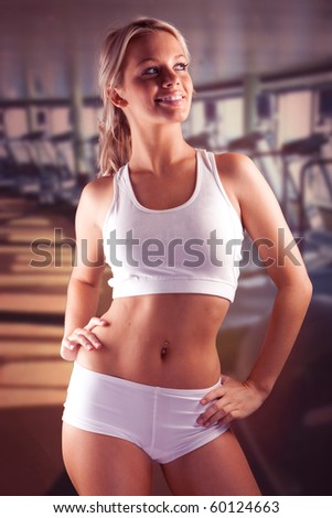 beautiful fitness smiling body passion for exercising. exhausted blonde wet doing workout