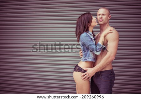 Soft Light Capture of Perfect Body Couple Showing Love Intense Pose. Isolated Gray Curves